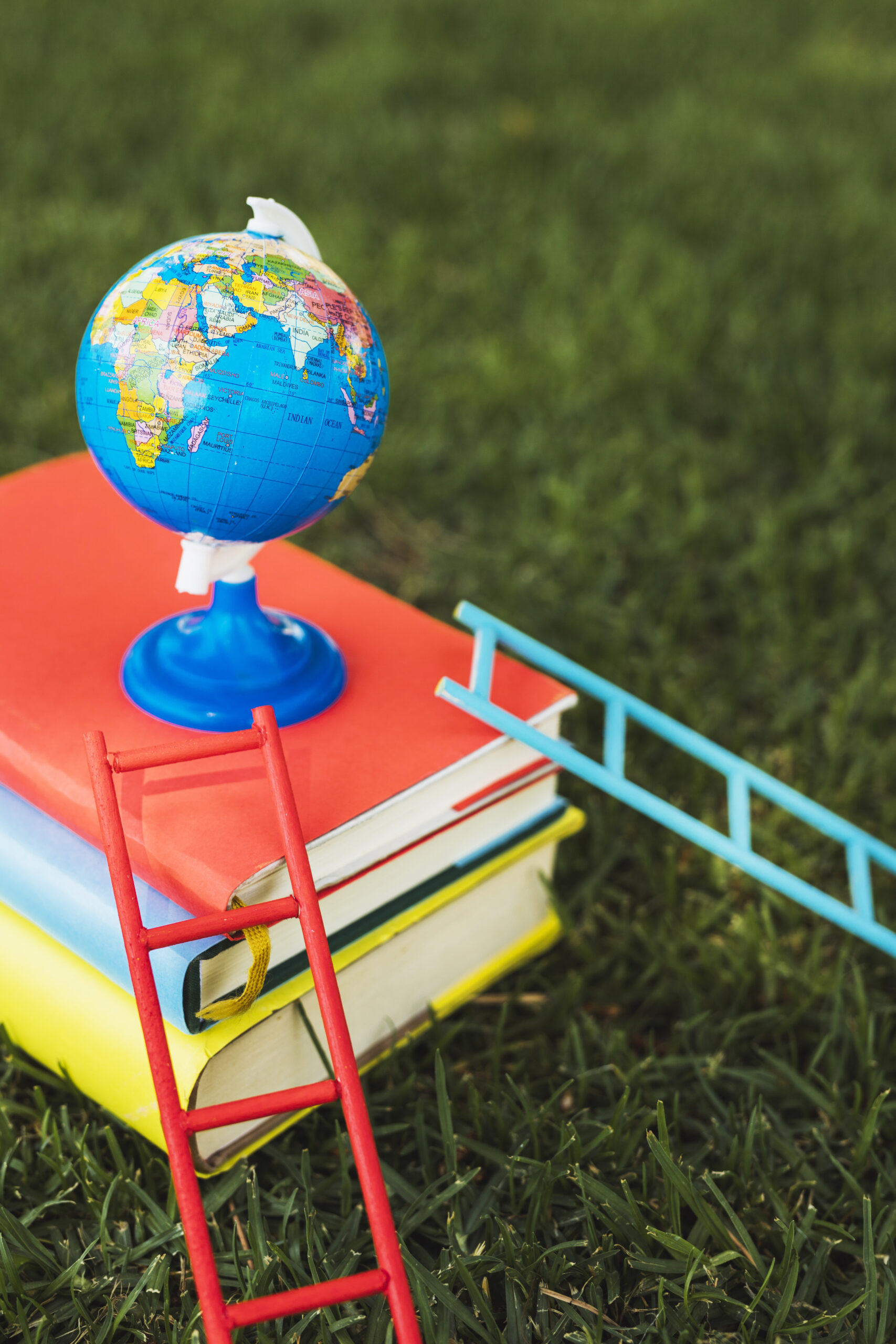 small-globe-arranged-top-books-stack