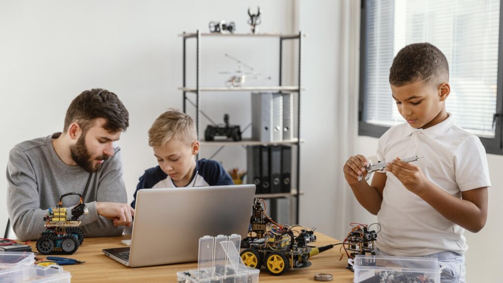 father-sons-making-robot