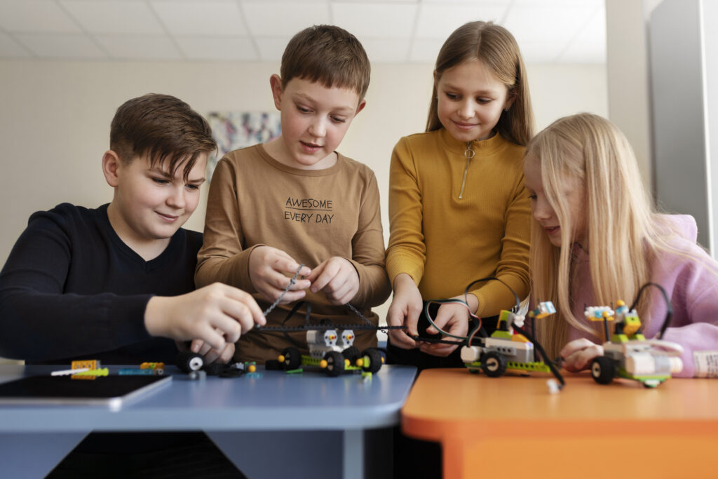 four-kids-building-drone-using-electronic-parts